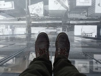 Low section of man standing on floor