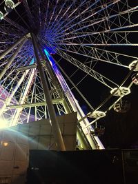 Low angle view of illuminated ferris wheel