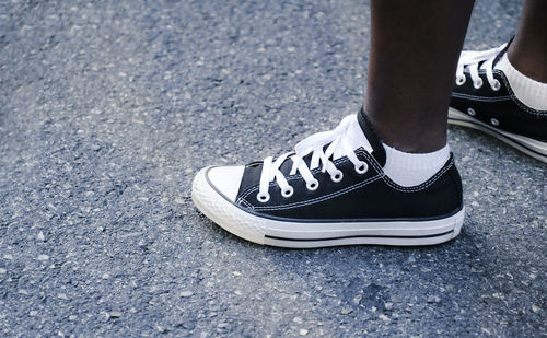 Low section of person standing on street