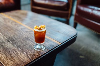 High angle view of beer glass on wooden table