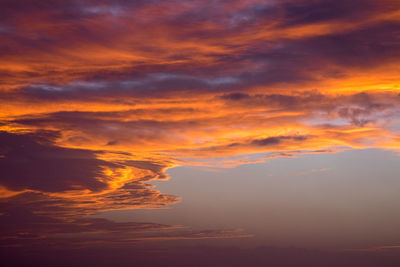 Low angle view of dramatic sky during sunset