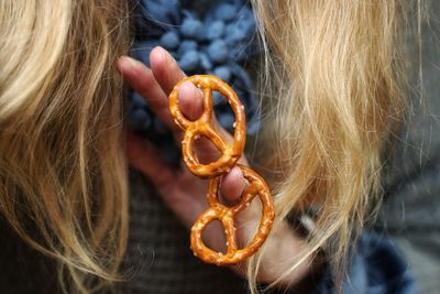 Close-up of woman with pretzel