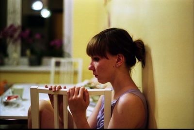 Close-up of woman playing with table at home