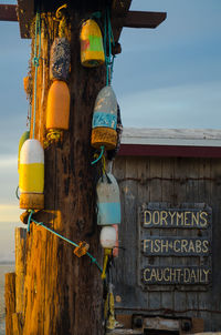 Buoy hanging on wooden post