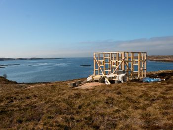 Building of bird observation tower, stony island norway. wooden construction of lookout tower