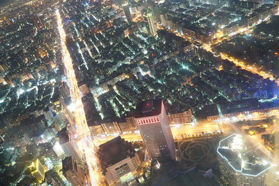 Aerial view of illuminated city at night