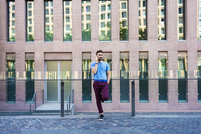 Full length of young man running