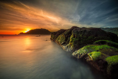 Scenic view of sea against sky at sunset