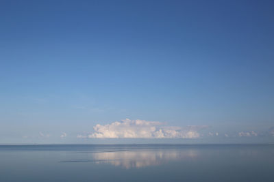 Calm ocean sound with low clouds on a clear morning