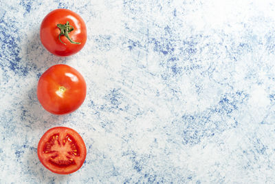 High angle view of tomatoes against white background