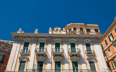 Low angle view of building against blue sky