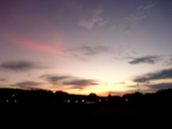 Silhouette of trees against sky at sunset