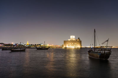 Traditional dhow moored near the museum of islamic art doha, qatar. 