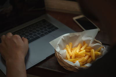 Low angle view of person preparing food on table