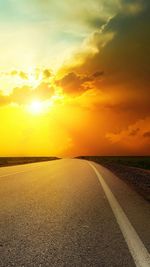 Scenic view of road against sky during sunset