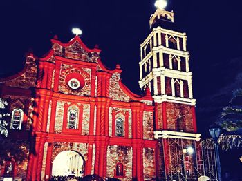 Low angle view of illuminated building at night