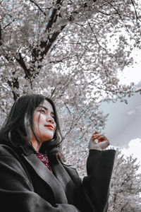 Portrait of smiling woman in snow