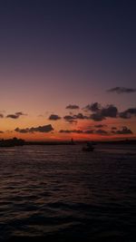 Scenic view of sea against romantic sky at sunset