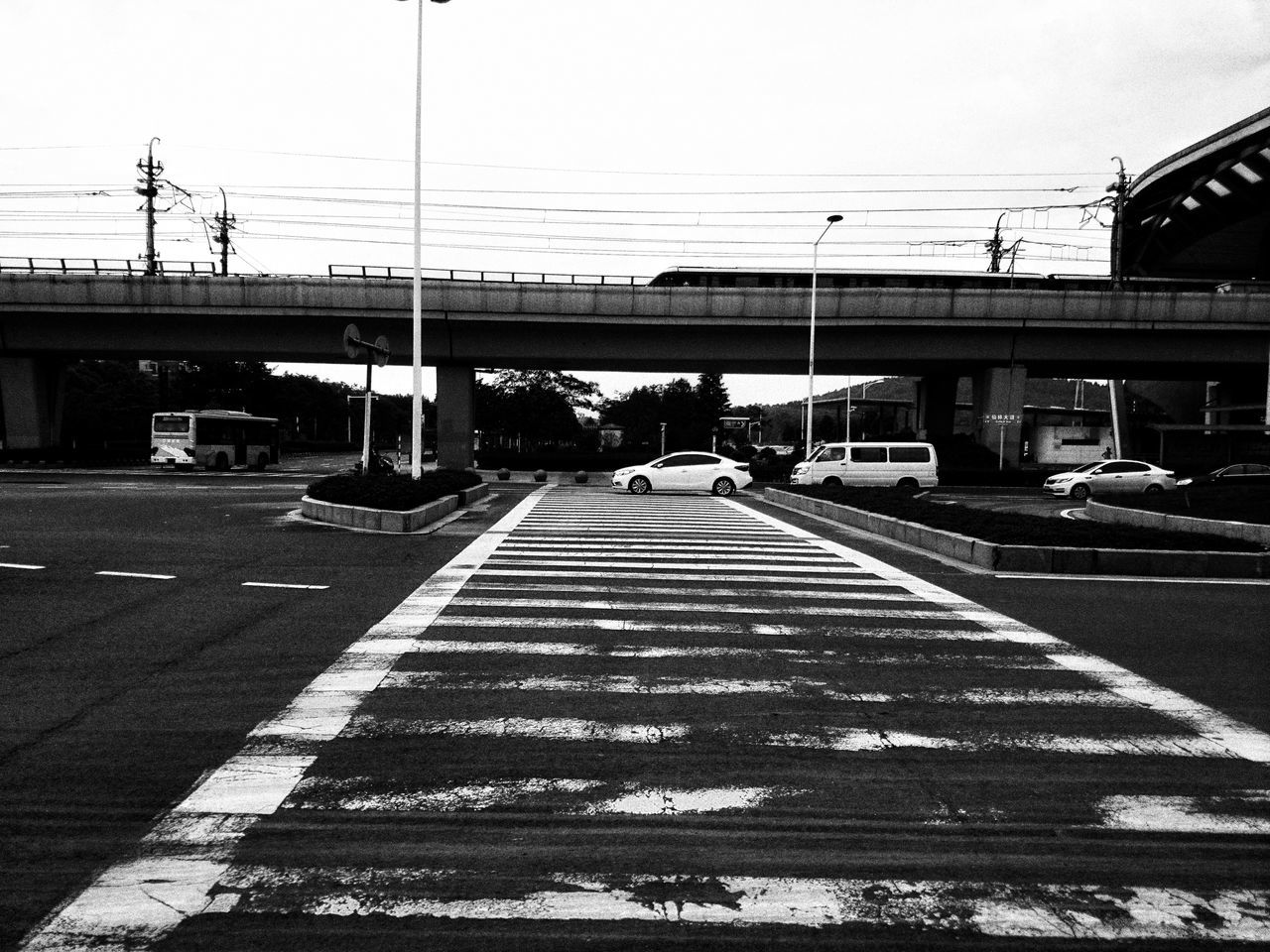 built structure, railroad track, architecture, power line, public transportation, city, sky, cable, power supply, outdoors, day, the way forward, no people, diminishing perspective, railway track, empty, city life