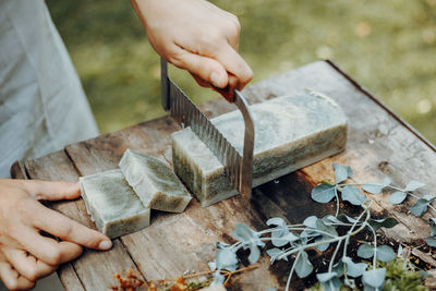 Making handmade natural soaps on an old wooden table