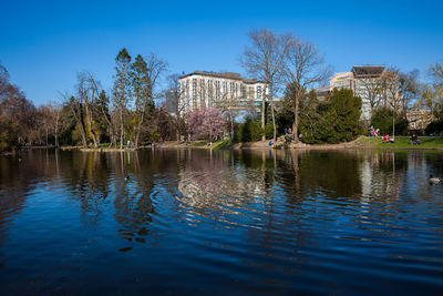 Scenic view of lake against clear blue sky