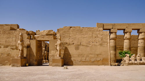 Exterior of historic temple against clear sky