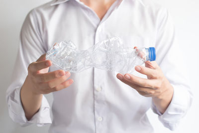 Midsection of man holding ice cream