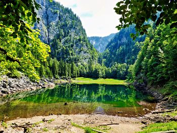 Scenic view of lake and mountains against sky