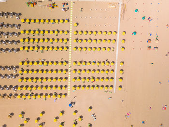 Multi colored umbrellas on sand