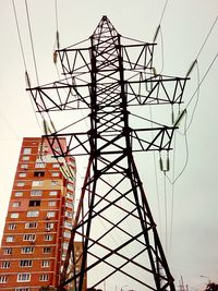 Low angle view of electricity pylon