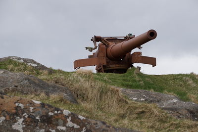 Horse cart on mountain against sky