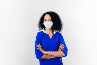 Portrait of a woman against white background