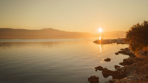 Scenic view of sea against sky during sunset