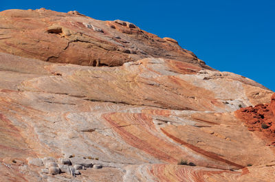 Low angle landscape of multi-colored stone hillside at valley of fire state park in nevada