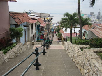 Street amidst buildings against sky