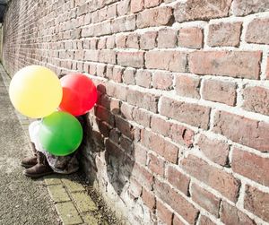 Close-up of person with balloons