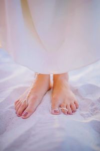 Low section of woman relaxing on floor