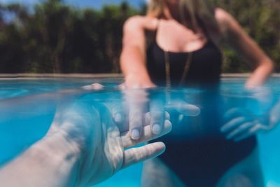 Close-up of man swimming in pool