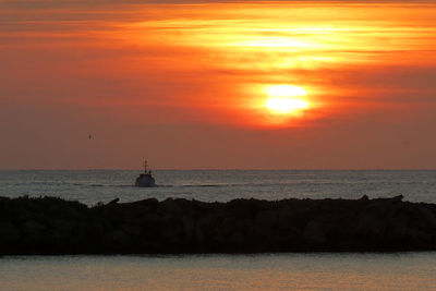 Scenic view of sea at sunset