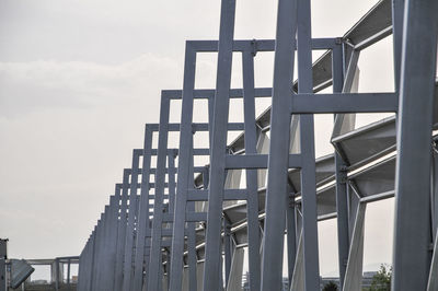 Low angle view of bridge in city