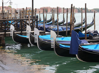 Boats moored in canal