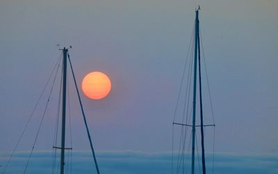 Low angle view of sailboat against sky during sunset