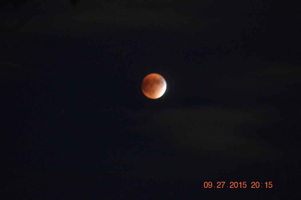 LOW ANGLE VIEW OF MOON IN THE DARK