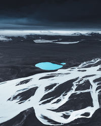 Scenic view of sea against sky during winter