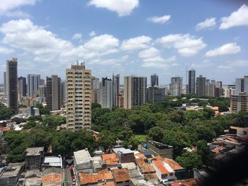 Buildings in city against sky