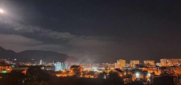 High angle view of illuminated buildings in city at night