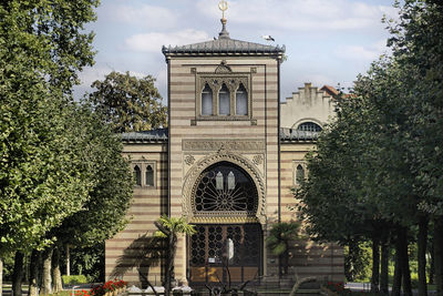 Facade of historic building against sky