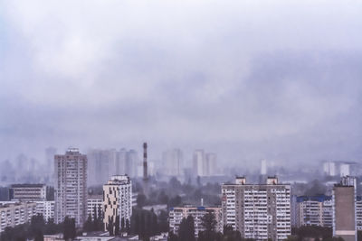 Modern buildings in city against sky