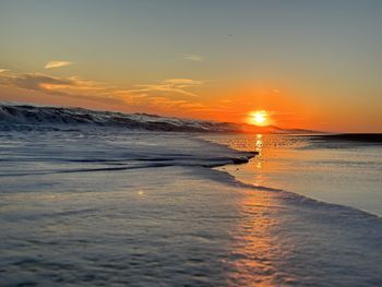 Scenic view of sea against sky during sunset