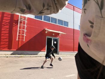 Full length of man on street against building in city